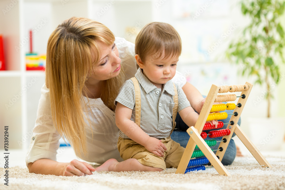 kid playing with abacus