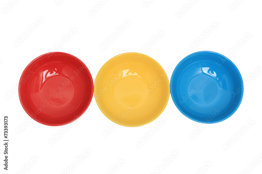 Row with three colorful bowls isolated over white Row with three colorful bowls isolated over white