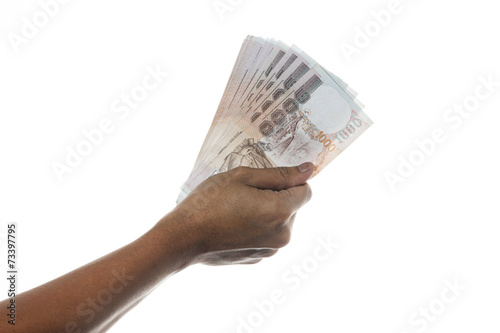 Hand holding Thailand money bills