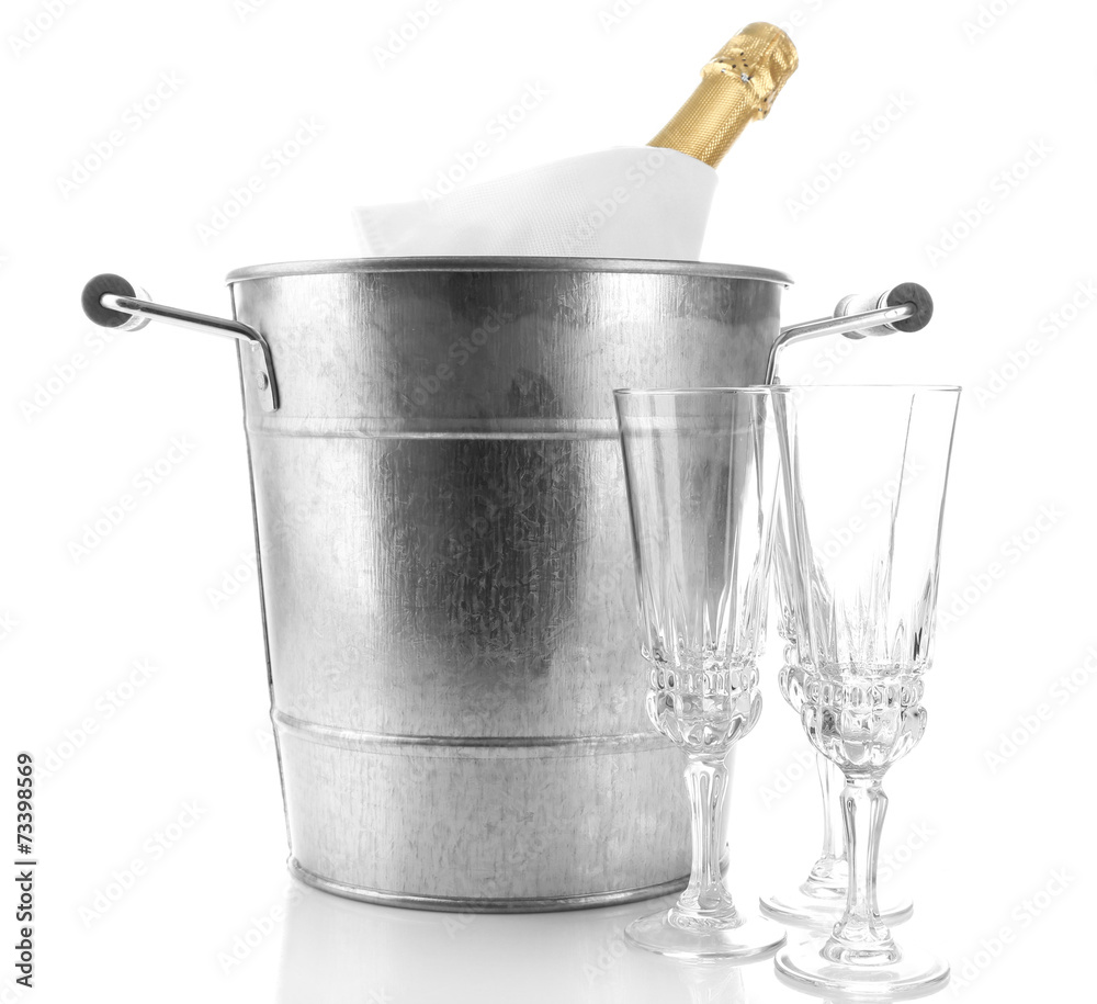 Bottle of champagne in metal ice bucket and two glasses Bottle of champagne in metal ice bucket and two glasses