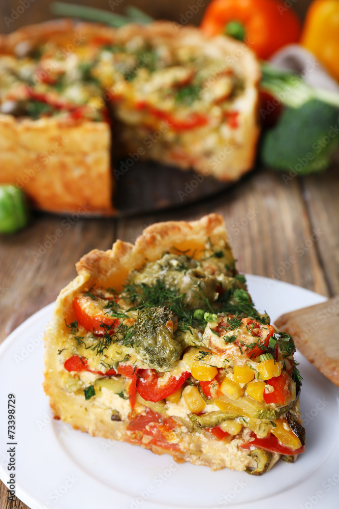 Piece of Vegetable pie with broccoli, peas, tomatoes and cheese Piece of Vegetable pie with broccoli, peas, tomatoes and cheese