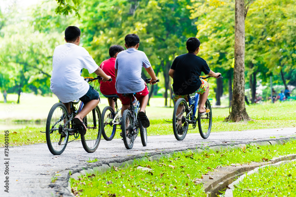 childrens ride bikes in park