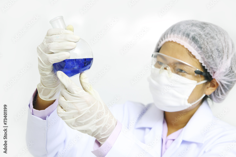 Chemist holding sample of liquid in lab or laboratory Chemist holding sample of liquid in lab or laboratory