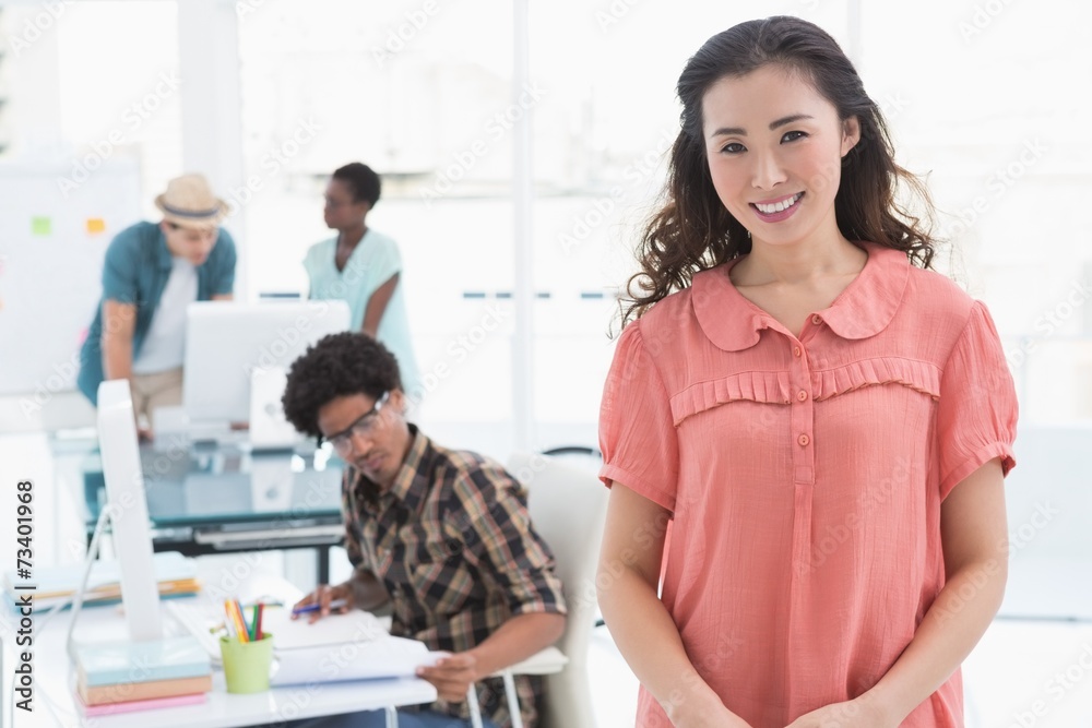 Fototapeta premium Young creative woman smiling at camera