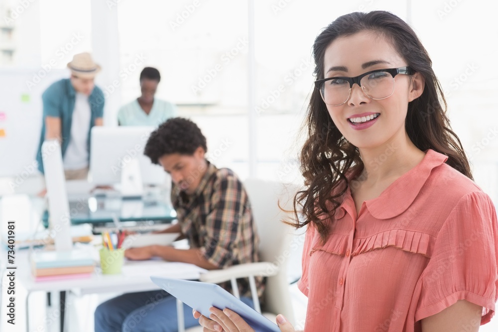 Fototapeta premium Young creative woman using her tablet