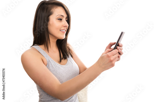 Young female tourist sending greetings in video conversation