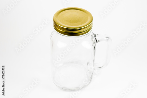 An empty clear jar with the cap