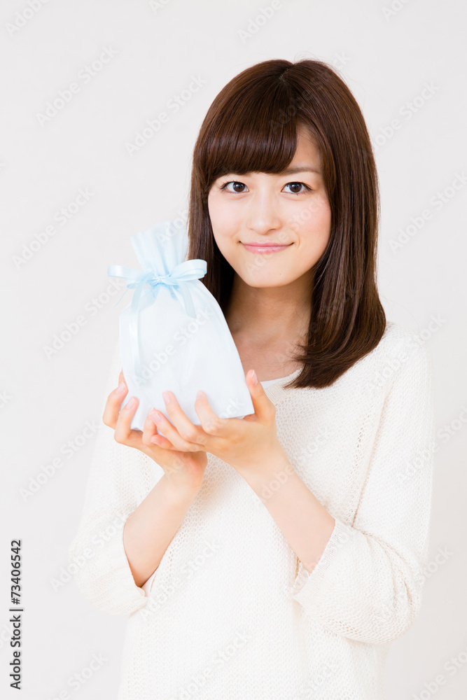 young asian woman with gift on white background young asian woman with gift on white background