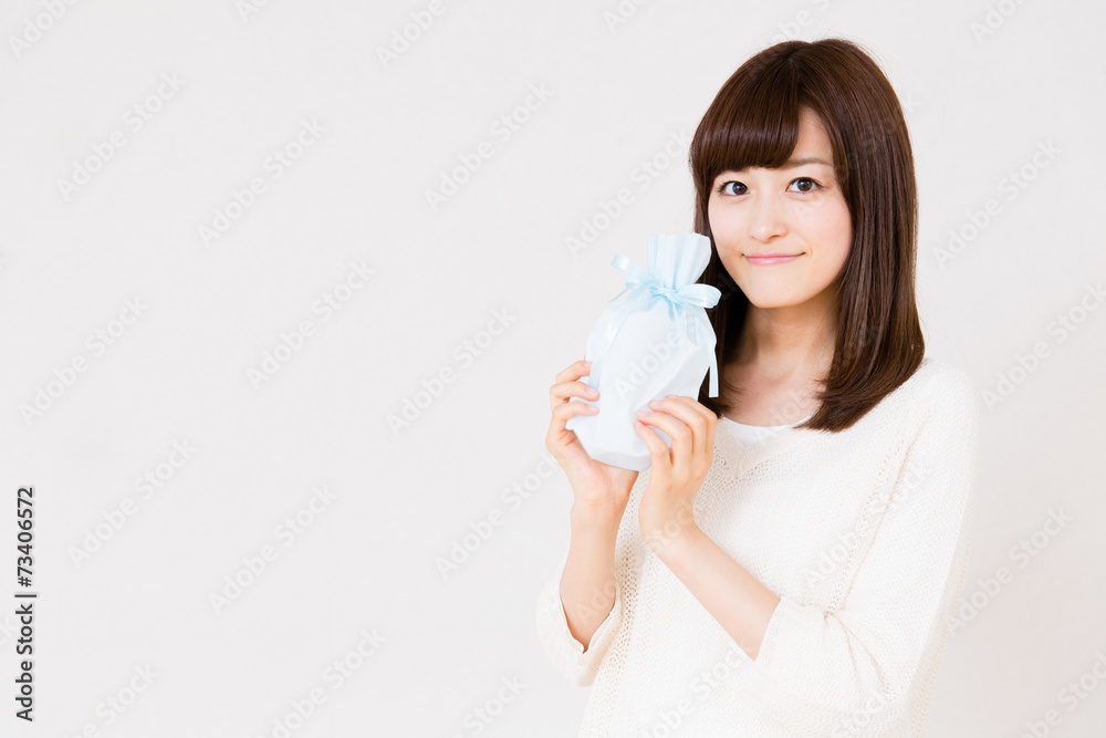 young asian woman with gift on white background young asian woman with gift on white background