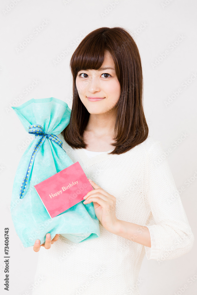young asian woman with gift on white background young asian woman with gift on white background