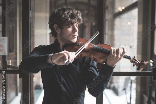 Photography young handsome blonde violinist