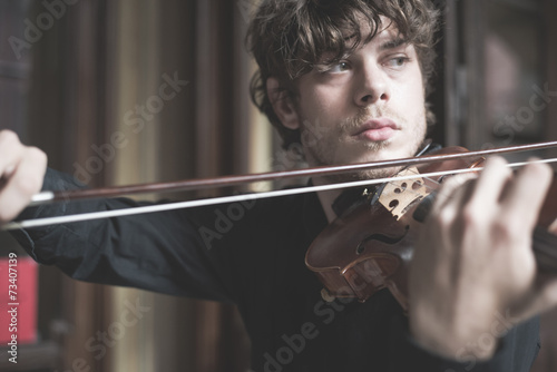 young handsome blonde violinist