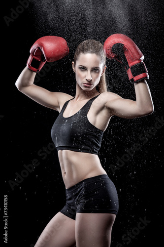 Beautiful woman wearing boxing gloves © and.one