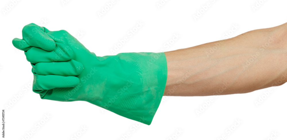 Hand in green rubber glove shows fig sign