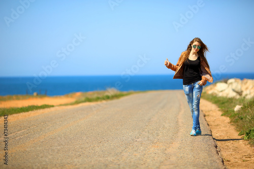 beautiful girl posing on the road