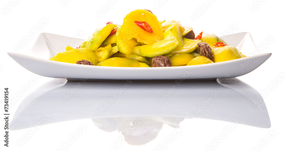 Pickled young mango with dried tamarind and chili slices