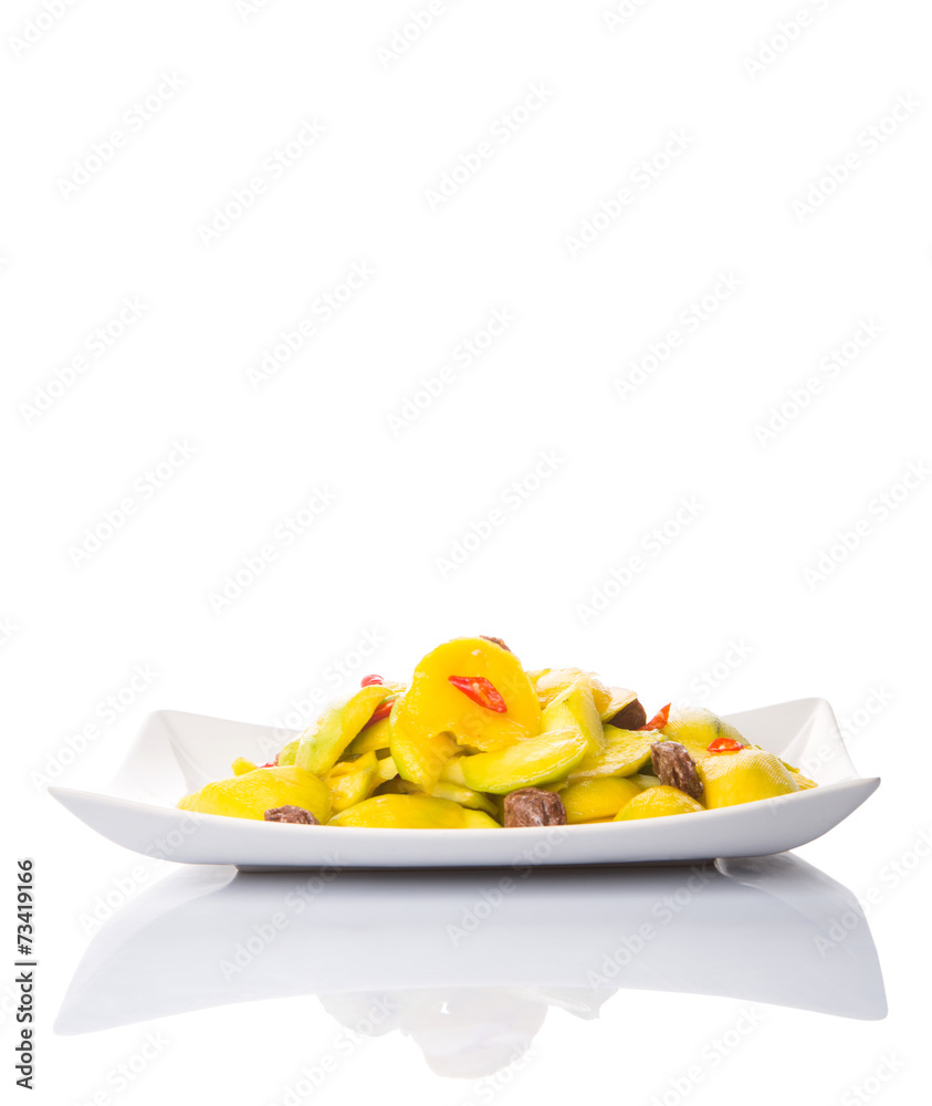 Pickled young mango with dried tamarind and chili slices Pickled young mango with dried tamarind and chili slices