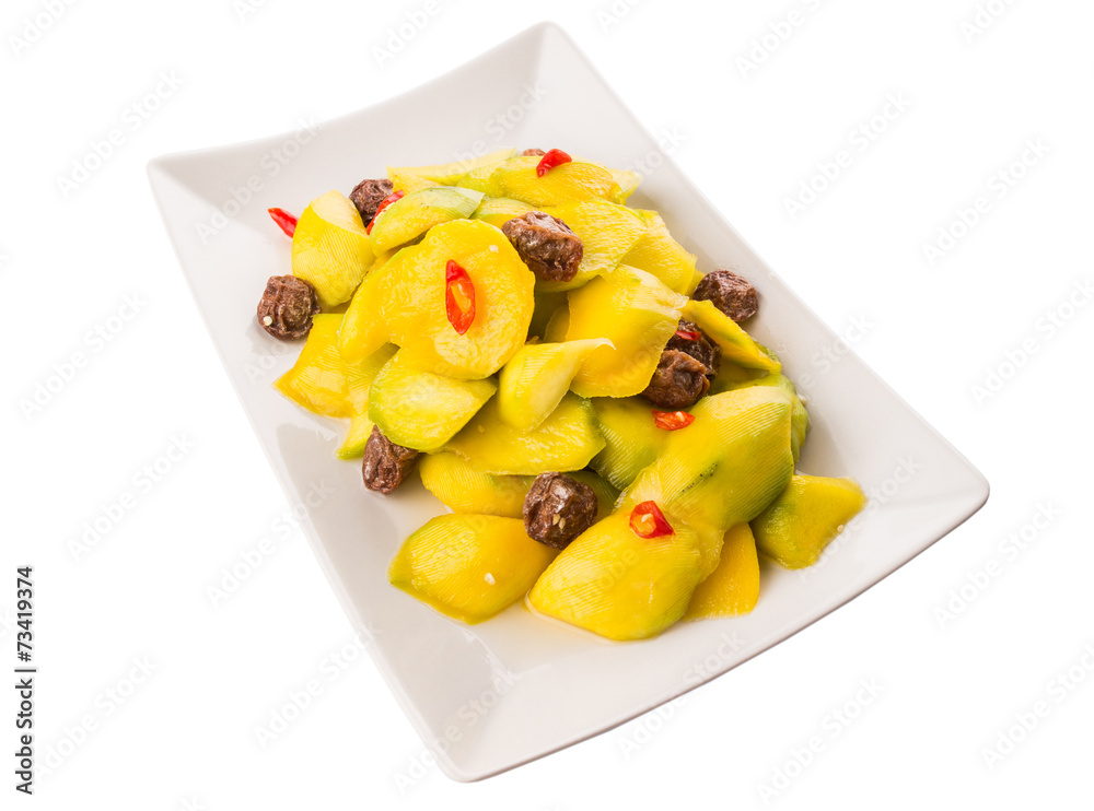 Pickled young mango with dried tamarind and chili slices Pickled young mango with dried tamarind and chili slices