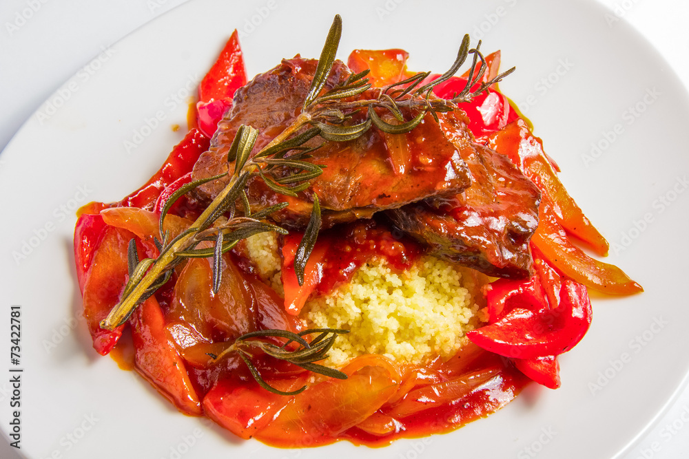 Couscous with lamb in sweet and sour tomato sauce. Couscous with lamb in sweet and sour tomato sauce.