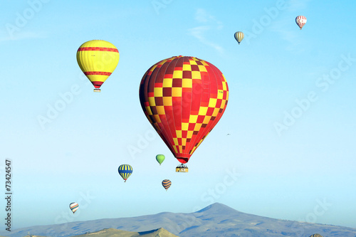 Hot air balloon flying over Cappadocia.