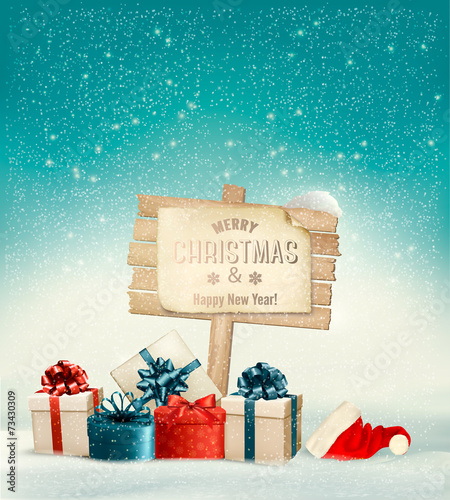 Winter christmas with a sign, gift boxes and a santa hat backgro