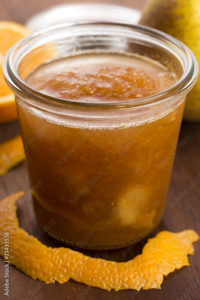 glass of pear jam with orange glass of pear jam with orange