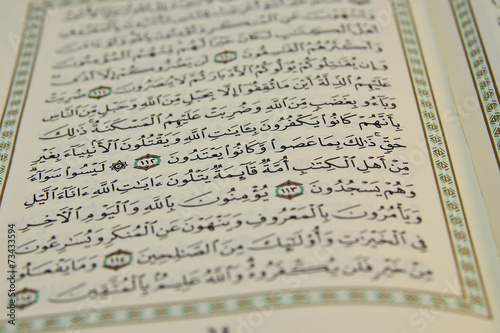 Open Koran with arabic writing visible