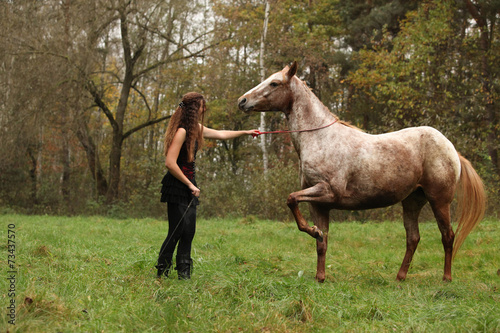 Young girl working with horse, natural horsemanship © Zuzana Tillerova