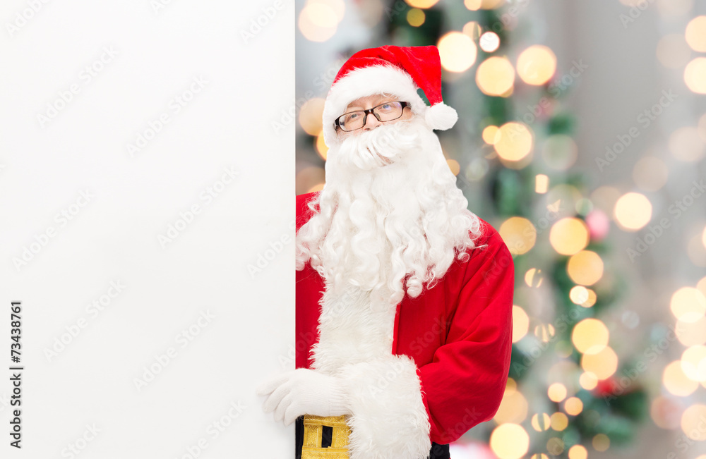 man in costume of santa claus with billboard man in costume of santa claus with billboard