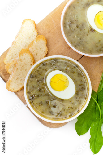 Sorrel soup with egg and greens. Selective focus.