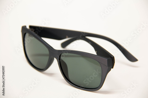 Black sunglasses on a white background.