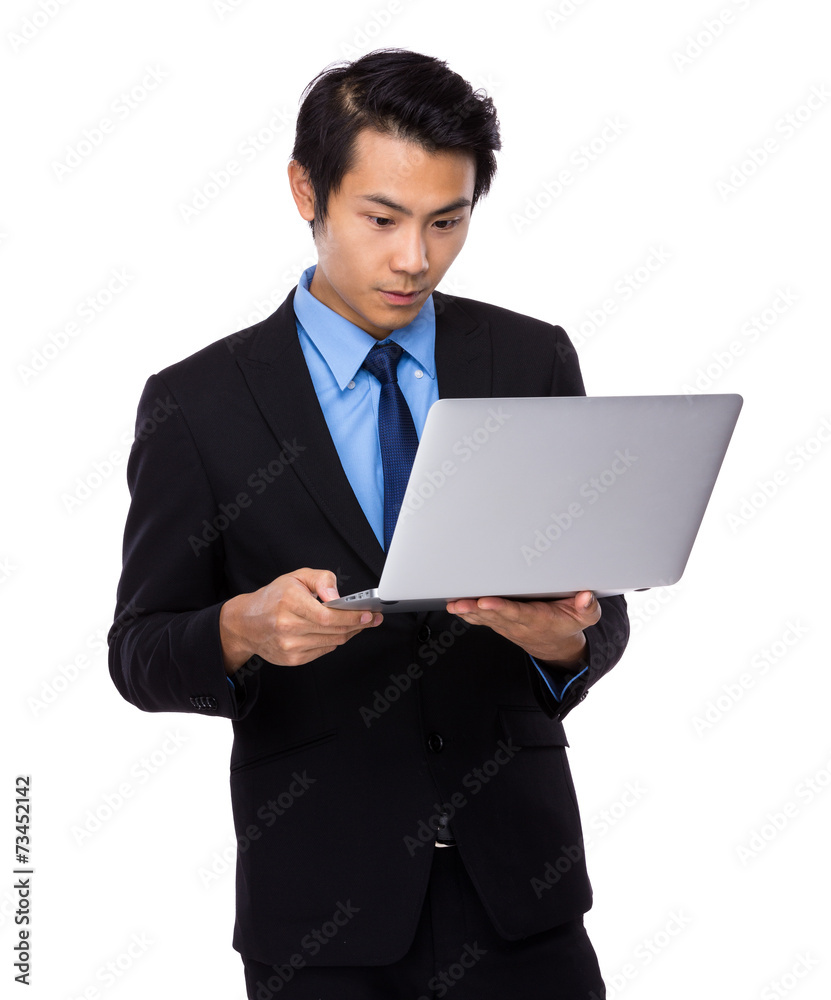 Asian Businessman use of notebook Asian Businessman use of notebook