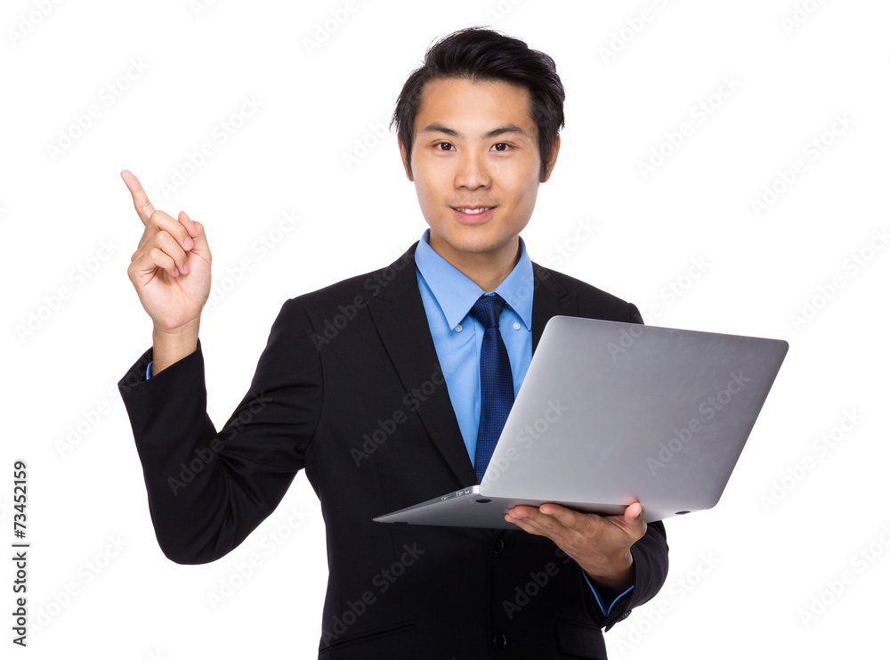 Business man use of notebook and finger point up Business man use of notebook and finger point up