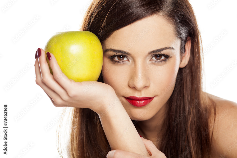 beautiful young woman holding an apple beautiful young woman holding an apple