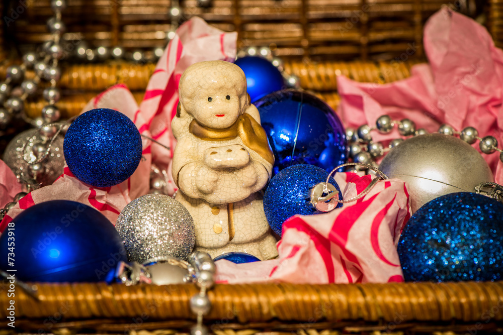 Christmas decoration on warm background with little angel