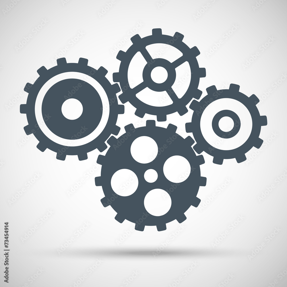 Toothed gears is meshed on gray background Toothed gears is meshed on gray background