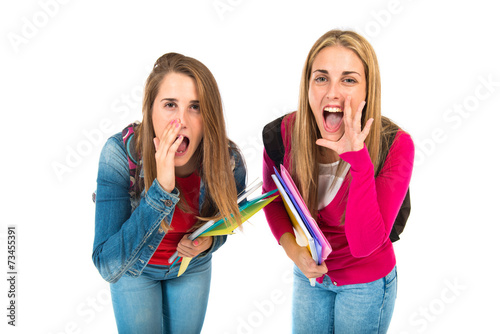Student women shouting over isolated white background