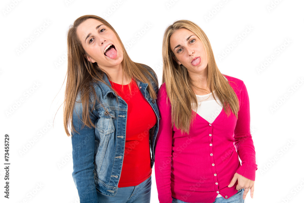 Students doing a joke over isolated white background Students doing a joke over isolated white background