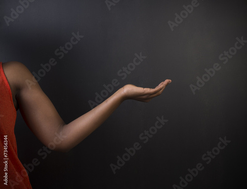 South African or African American woman teacher hand