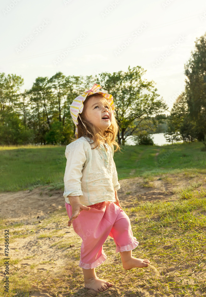 Cute happy kid enjoying summer outdoors. Cute happy kid enjoying summer outdoors.
