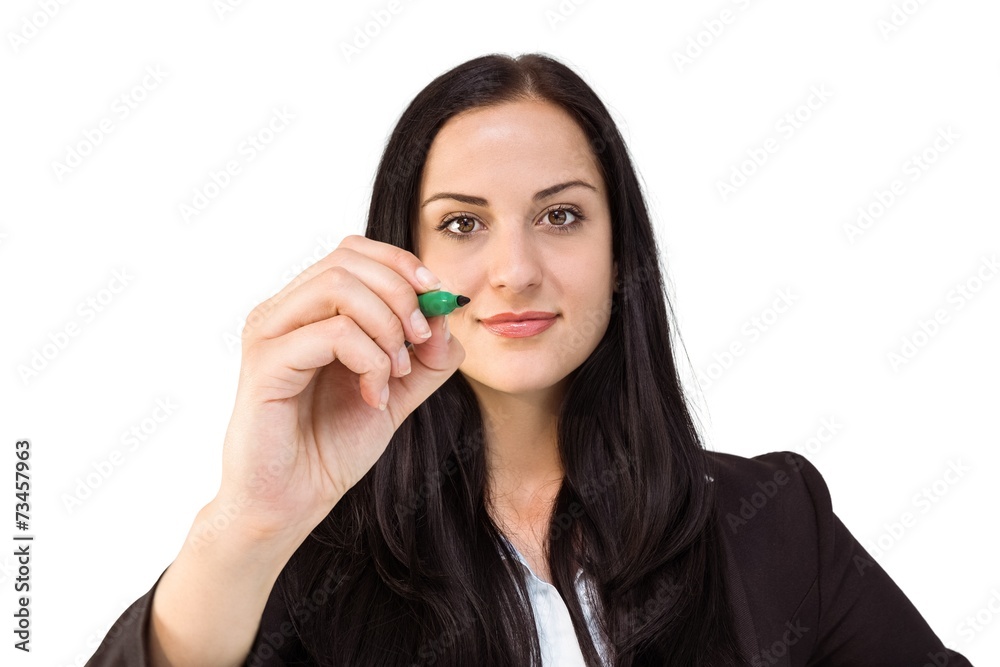 Pretty businesswoman writing with marker Pretty businesswoman writing with marker