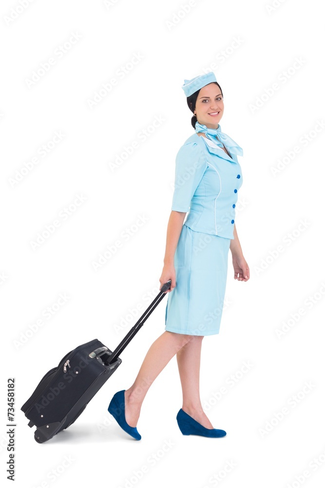 Pretty air hostess walking with suitcase Pretty air hostess walking with suitcase