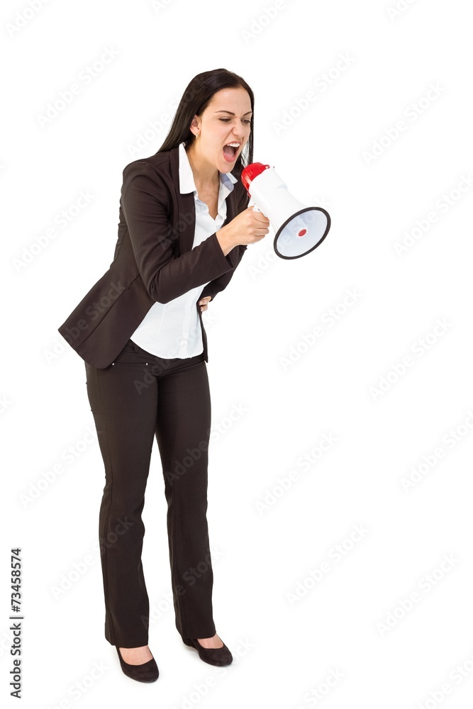 Pretty businesswoman shouting with megaphone Pretty businesswoman shouting with megaphone