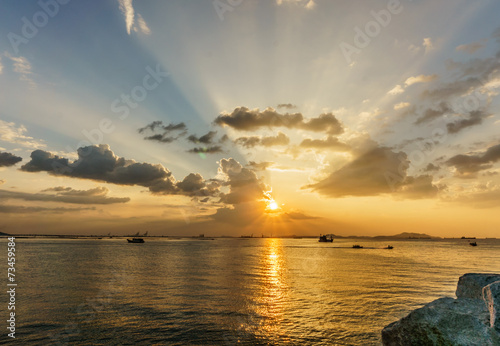 silhouette of fishing boat and sunset, with koh sichang and sri