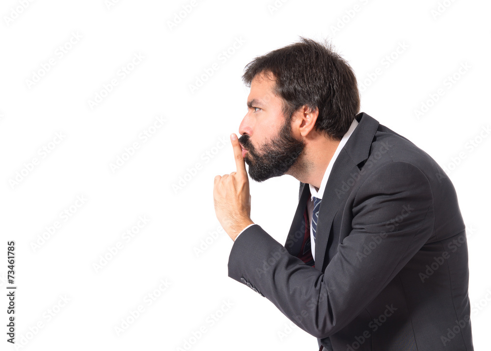 Businessman making silence gesture over isolated white backgroun Businessman making silence gesture over isolated white backgroun