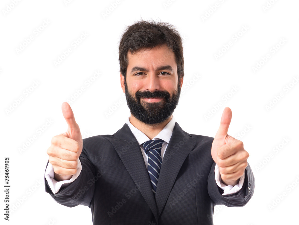 Businessman with thumb up over white background Businessman with thumb up over white background