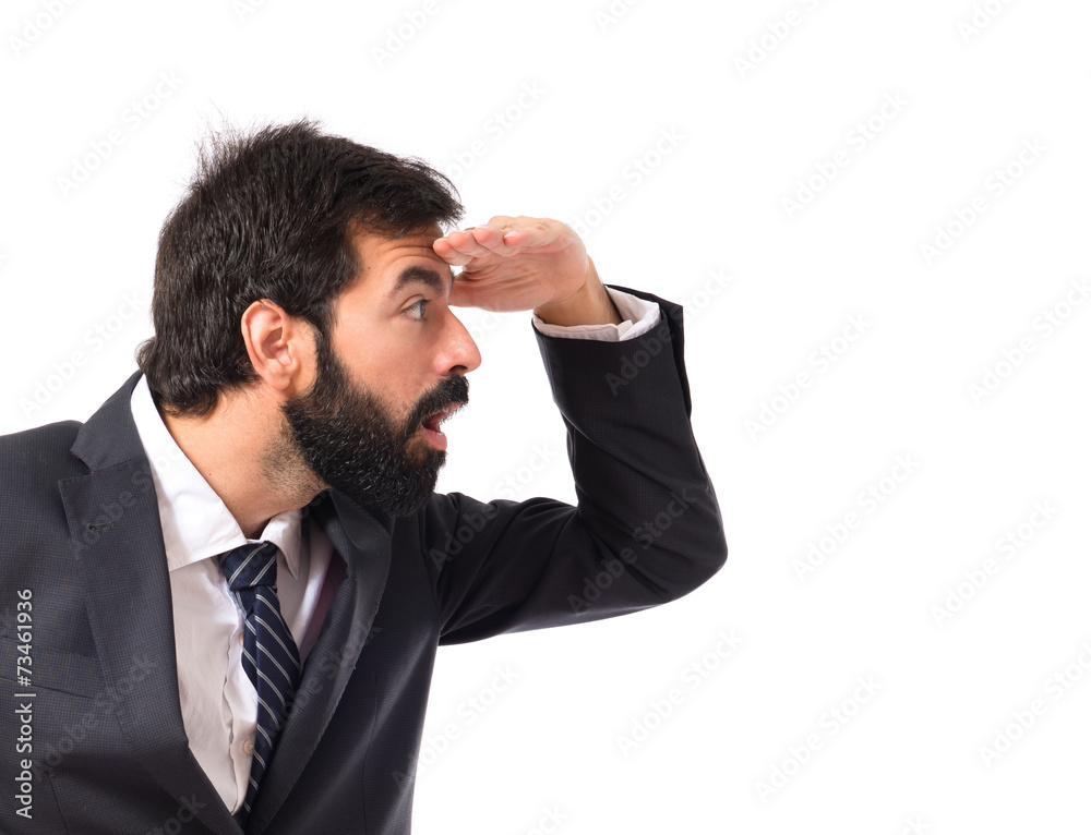 Businessman showing something over white background Businessman showing something over white background