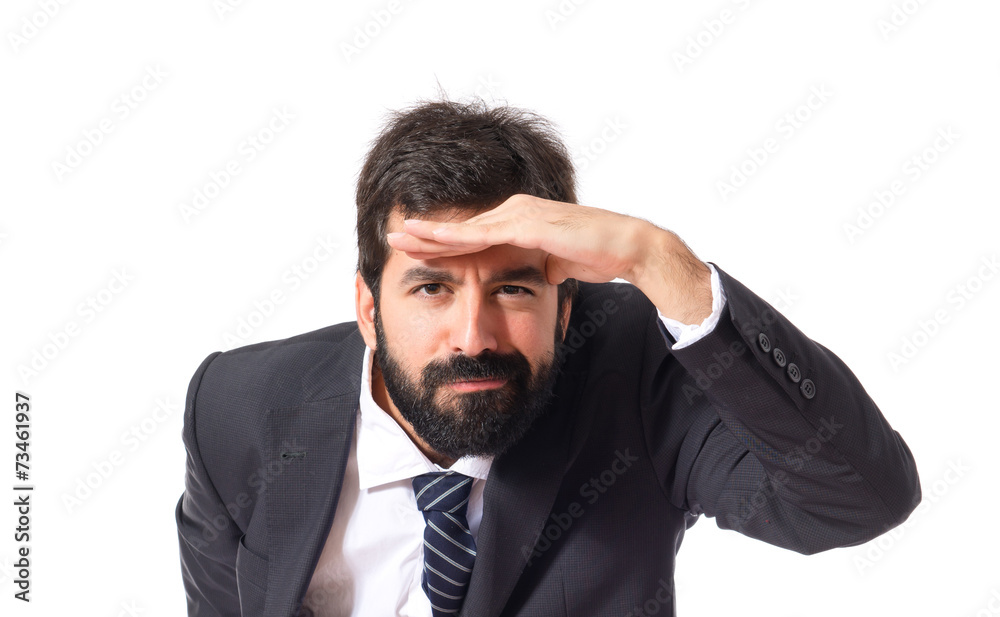 Businessman showing something over white background Businessman showing something over white background