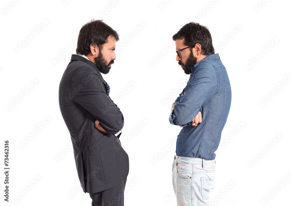 Furious twin brothers over white background Furious twin brothers over white background