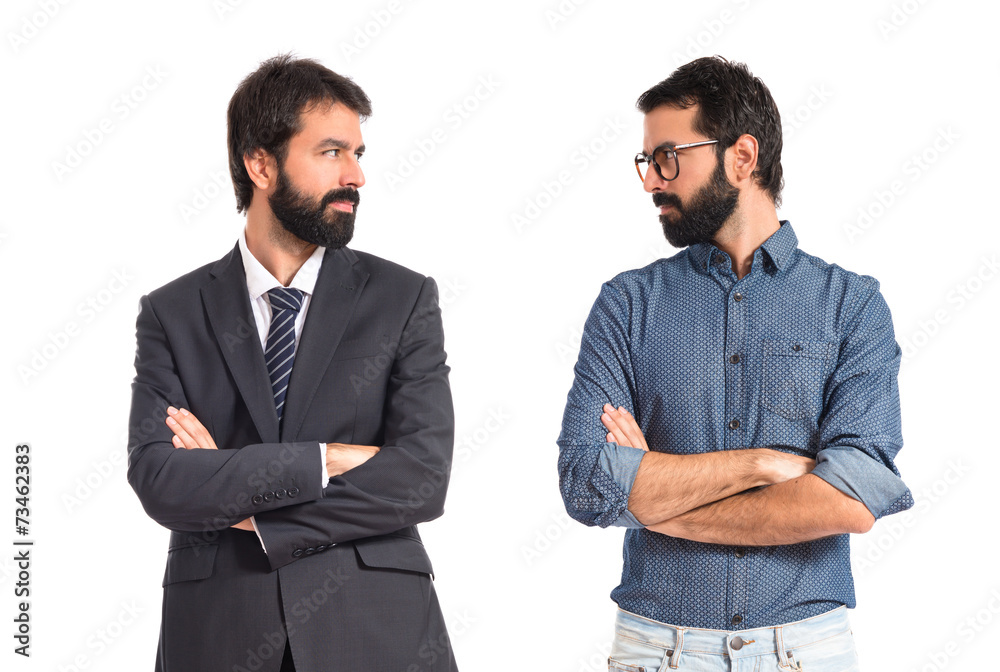 Brothers with his arms crossed over white background